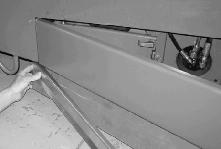 Hook the latch on the side squeegee retaining band. 9. Close the outer brush door. 6.