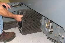 REPLACING OR ROTATING THE MAIN BRUSHES The front brush can be accessed on the left side of the machine and rear