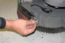 Pull the squeegee out from the side brush assembly. 1. If necessary, raise the scrub head.