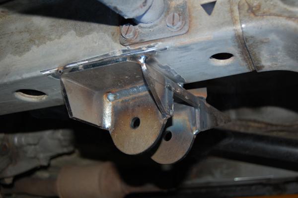 6. Place the 2x2 square piece of channel between the cross member and the rear control arm bracket.