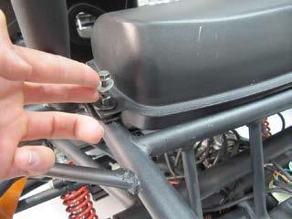 Install a washer onto each of the four bolts, and insert bolts through