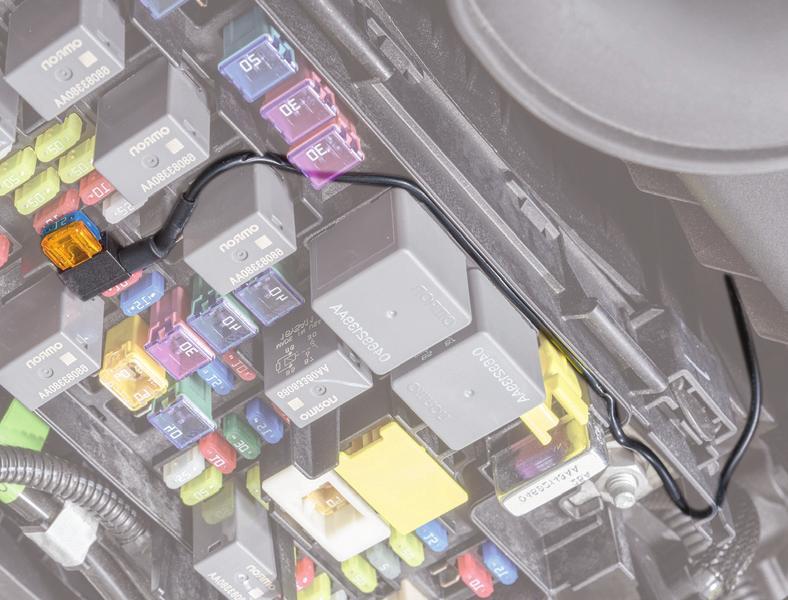 Remove the 15 amp fuse and install it in the lower slot of the light bar harness fuse