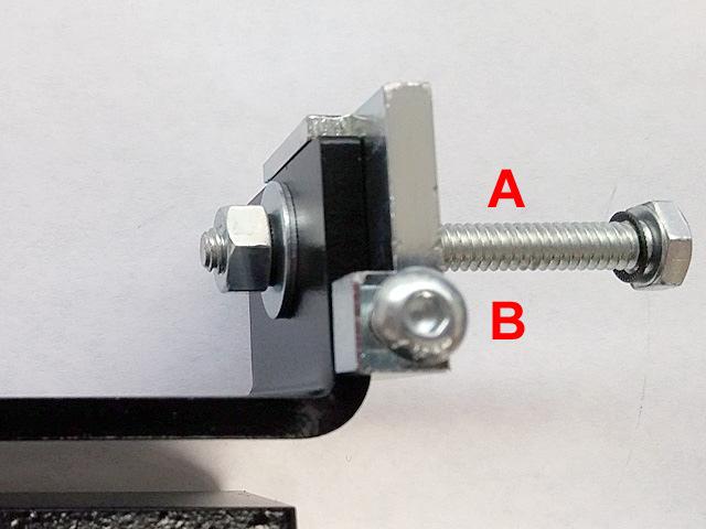 5. X-MOTOR Remove the nut and washers from the ¼ -20 bolt ( A ). Loosen the B screw until its end is flush with the tab on the bracket adjuster. Push the motor bracket to the tab. Fig.