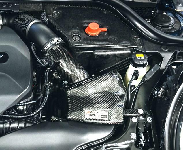 Install the AWE S-FLO Carbon Intake assembly by inserting into