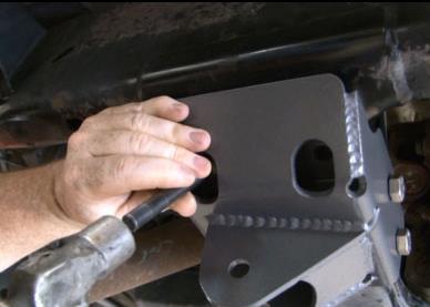 14. Install the new lower control arm mount with the supplied 14mm x 200mm long bolts. Do not tighten at this time. Hold the bracket up close to the frame and use a transfer punch to mark the frame.