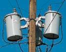 The transformer efficiencies are 00.0 percent and 97.0 percent, respectively.. Calculate the load current. 2. How much power is being dissipated by transformer T 2? 3.