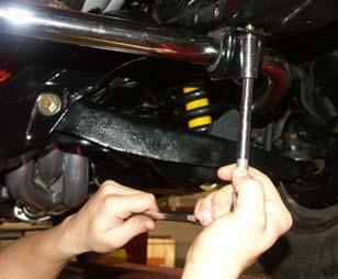 Pull down on stabilizer bar & install racket