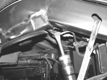 (use caution around the fuel and brake lines on inside of the frame rail).