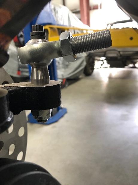 point bolt. 12. Install tie rod end assembly into the spindle with a washer and locknut on the other side. Torque to 40 ft.lbs. Put anti-seize on threads and thread jam nut on tie rod end heim.