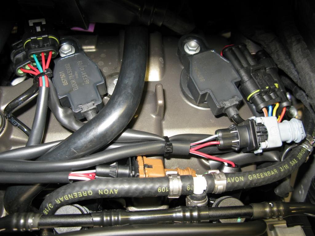 With the air box removed, connect the Bazzaz harness inline with the corresponding coils for the front two