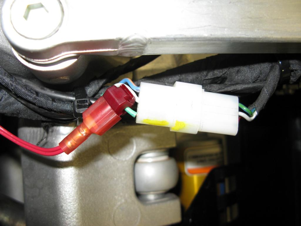 Insert the T-Tap connector on the Bazzaz harness with the red wire attached. (Photo 7) Stock Speed Sensor 12 Volt Power Photo 7 9. The stock gear lever is not equipped with a shift linkage / rod.