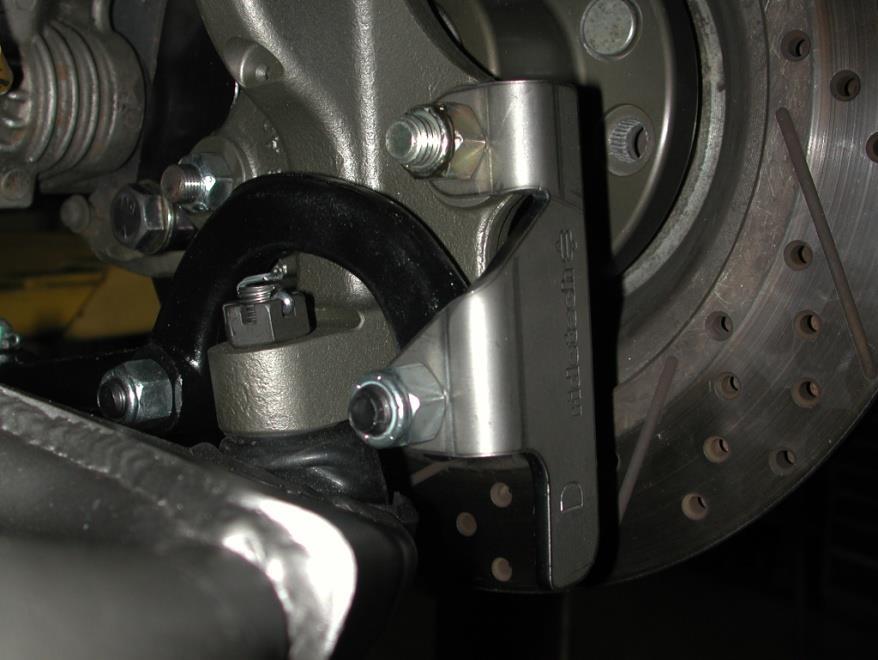 3. Install the Ridetech spindle on the control arms. 4. Install the steering arms and steering stops onto the spindle.