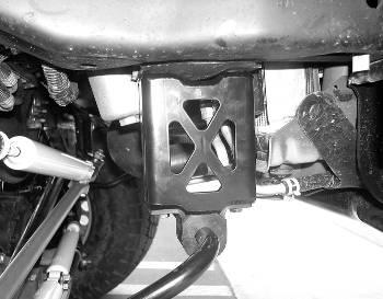 Using the supplied ¼ x 1 hardware, attach the brake line to the bracket. You will need to carefully bend the hard line down to meet the new brake line bracket. USE CARE NOT TO DAMAGE THE HARD LINE.