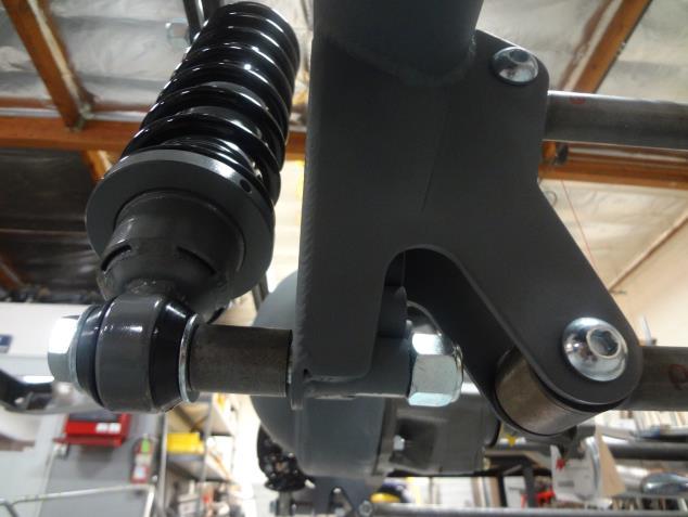 Install the provided spacer up against the back of the axle bracket.