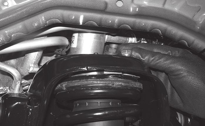 FIGURE 12 - STEP 9 10. Install the lower coilover bolt, torque to 120 ft-lbs. Next reinstall the tie rod and upper ball joint to the knuckle. Torque to 100 ft-lbs 11.