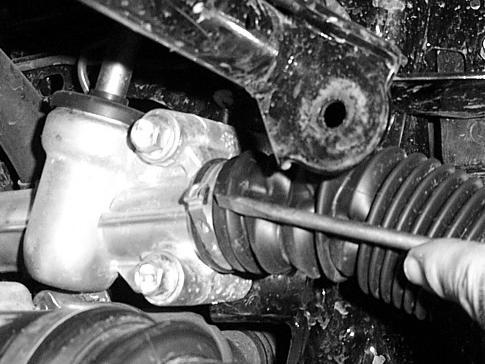 NOTE: A press or a vise is suggested for removing and replacing the ball joints. If you press in the ball joint crooked, DO NOT TRY TO FORCE IT IN!