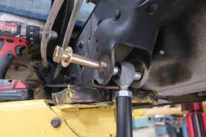 The Lower Mount gets attached to the TOP 2 holes of the Axle Mount. Insert the Bolts through the Aluminum Shock Mount with the 1 1/4 long bolt in the top hole, 1 3/4 in the bottom hole.