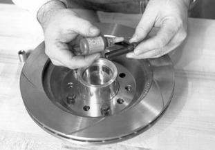 The bearing races are pressed in the billet hub from the factory. You must pack the wheel bearing before installing it.