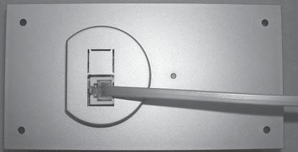 FIG. 11 d. Thermostat Installation I. Carefully separate the thermostat base plate from the thermostat cover. Insert a small screw driver into the slot on bottom of thermostat and disengage the tab.
