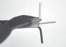 FIG. 22 Use Tip Of Pliers To Hold Wire In Place While Hand Bending Wire At 90 7.