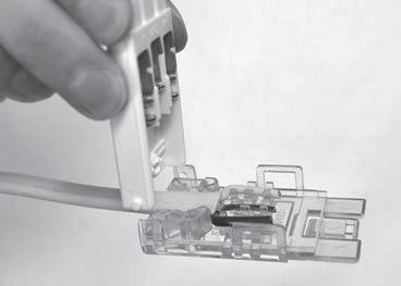 Squeeze the top and bottom closed with tongue and groove pliers. See (FIG. 27).