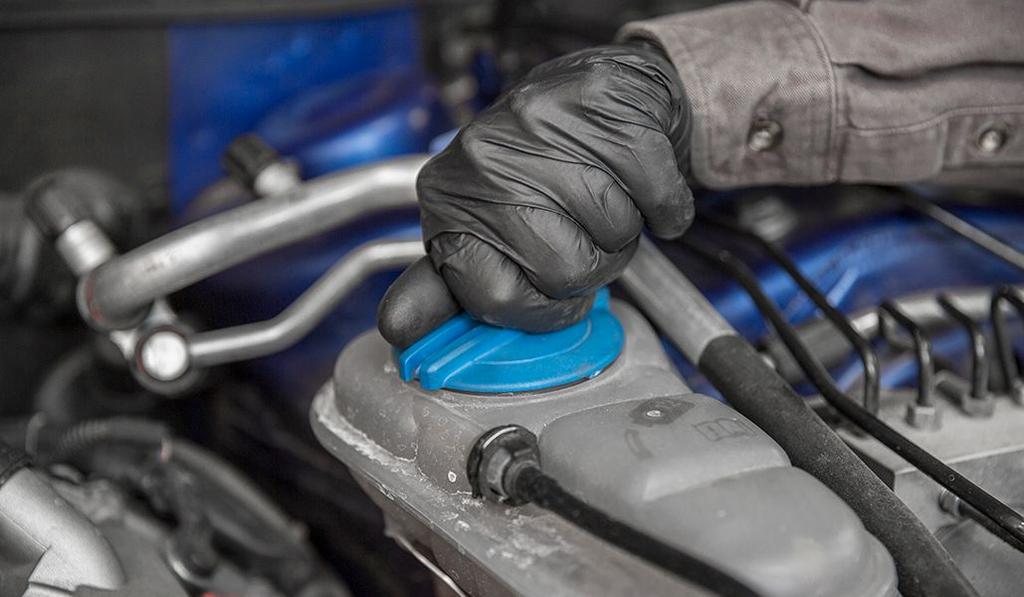 Loosen the coolant cap to remove any pressure from