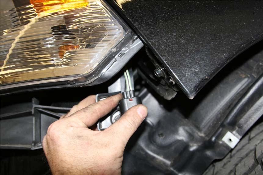 H. Remove the Plastic support under the headlights using a 10mm socket. I. Remove the Center Plastic support from the bottom of the OEM Grill. J. Re-install the OEM Grill. K. Remove the OEM Tow Hooks.