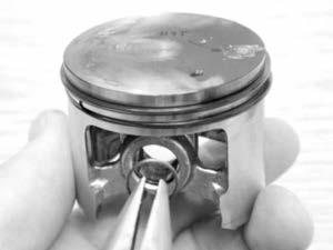 13.15 Install one (1) wrist pin retaining clip. 13.16 Make sure wrist pin retaining clip is in the proper orientation.