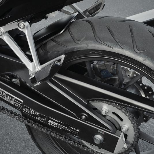 quality, carbon-look front mudguard featuring the Honda Racing logo, will give your bike the racer s touch.