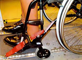 The rear of the wheelchair is attached with the belt around the rear axle. Note! Do not use snap hooks on the rear axle! See Fig.