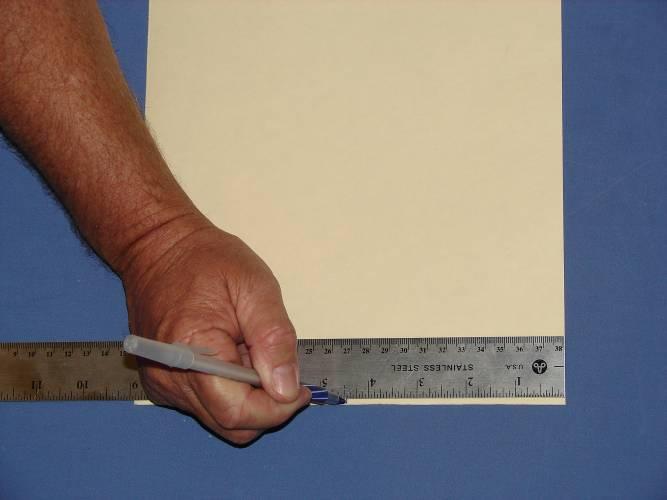3. Measure and mark the center of the template material as shown. 5.
