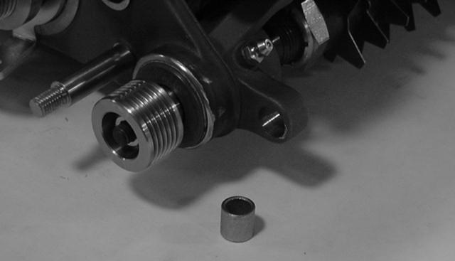 Hole in groomer drive 9. Loosely install the right-hand height-of-cut arm assembly onto the side plate using the existing carriage bolt, nut, and washer (Fig. ).