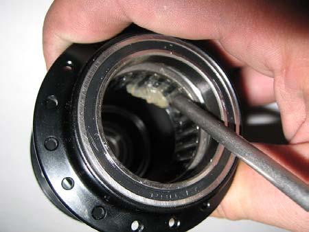 Apply a light oil or grease to the roller bearings inside the hubshell.