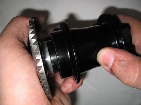 Re-assembly: Press the axle and freewheel insert back into the hub shell until the insert is flush