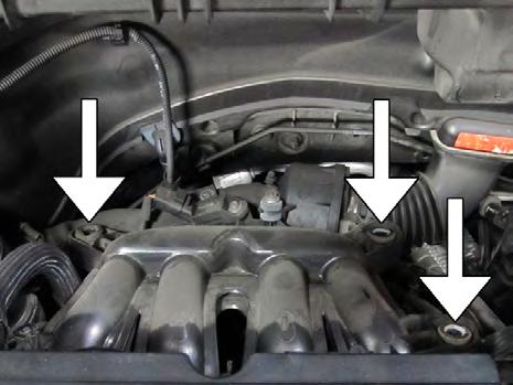 the valve cover by pulling up on the front edge.