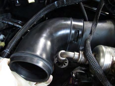 Install the AEM air box assembly onto the 3 mounting grommets