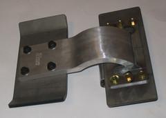 The steel mount flange of the hinge is to be bolted to the steel mount plate with a large hole.
