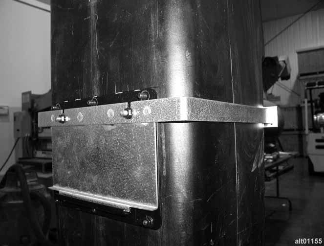 With mounting bracket securely fastened to front side of duct, attach hinged template to mounting bracket as shown in Figure 20.