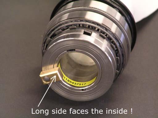 Make sure that the long side of the sliding nut faces the inside