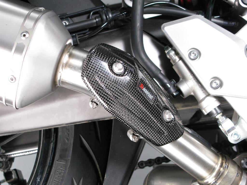 For optional carbon fiber heat shield only: position the carbon fiber heat shield onto the muffler pipe and hand tighten the tape clamps.