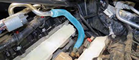 42. Using pliers, carefully remove the factory oil cooler hose from the hard line and oil cooler.