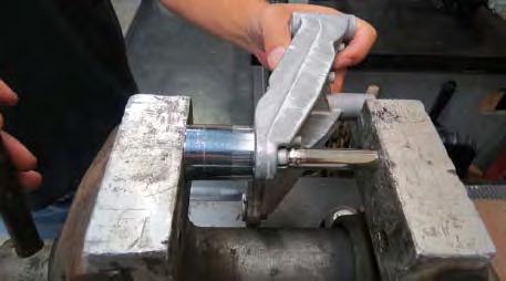 Carefully install the bushings into the supplied FEAD bracket using a vise or equivalent.