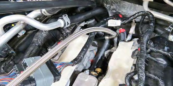 Reconnect the alternator voltage control connector and the alternator power cable. 56.