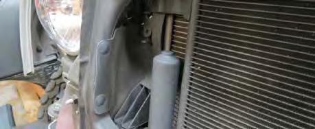 Remove the passenger side radiator shroud using a panel