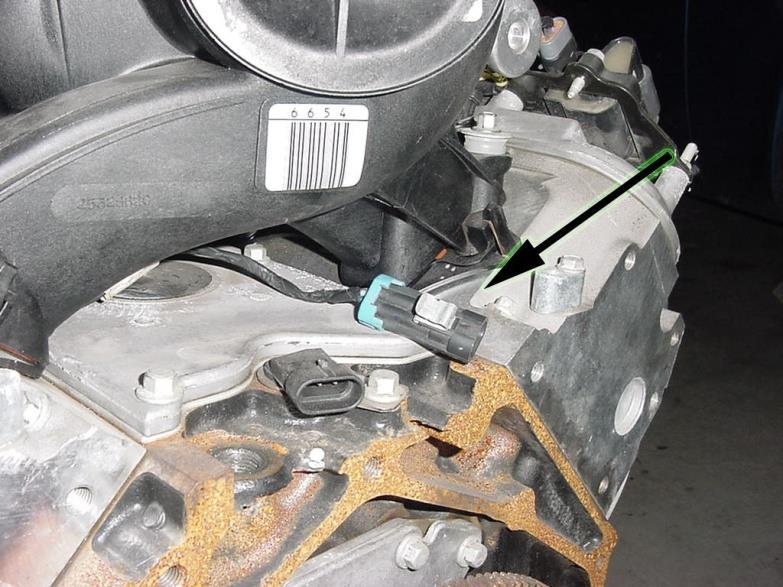 2. Plug the black, three pin, cam position sensor connector (labeled CMP) into the cam position sensor located in the engine block at the back of the intake manifold.