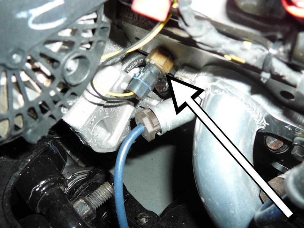 6. Plug the white, seven pin, driver side coil connector (labeled DRVR COILS) into the mating coil harness located on the driver side valve cover. 7.