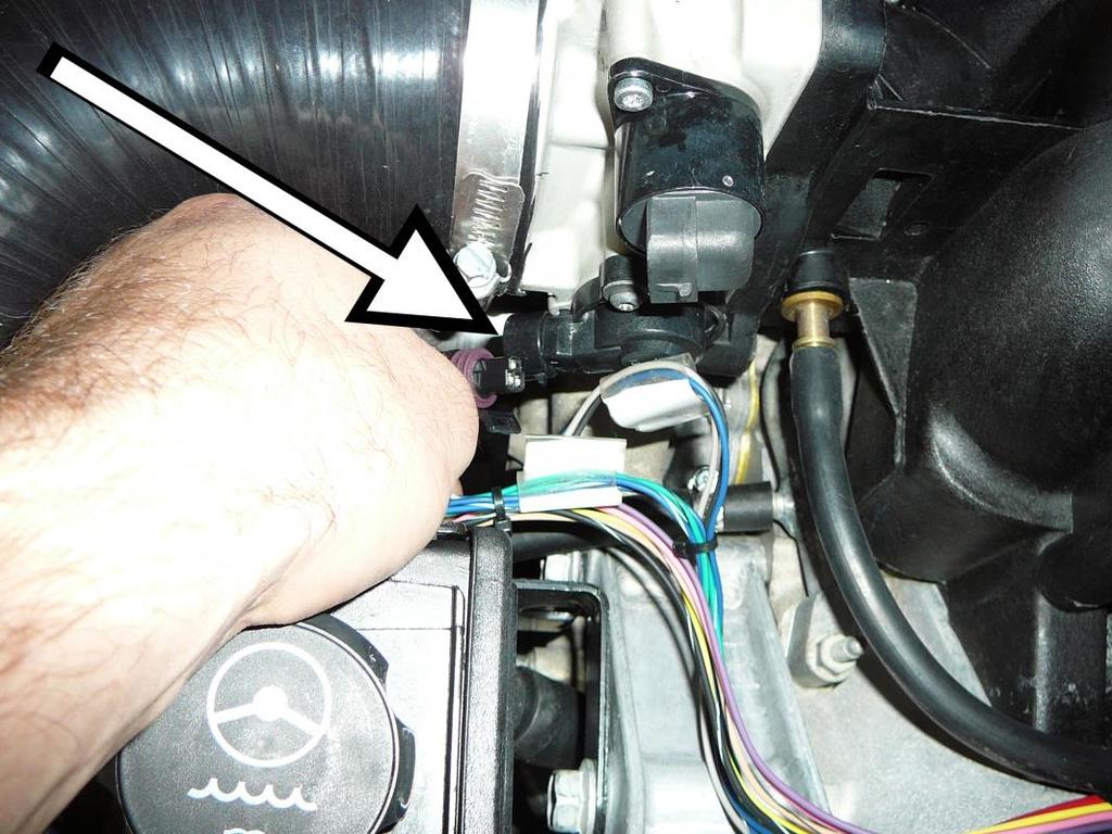 8. Plug the black, three pin, throttle position sensor connector (labeled