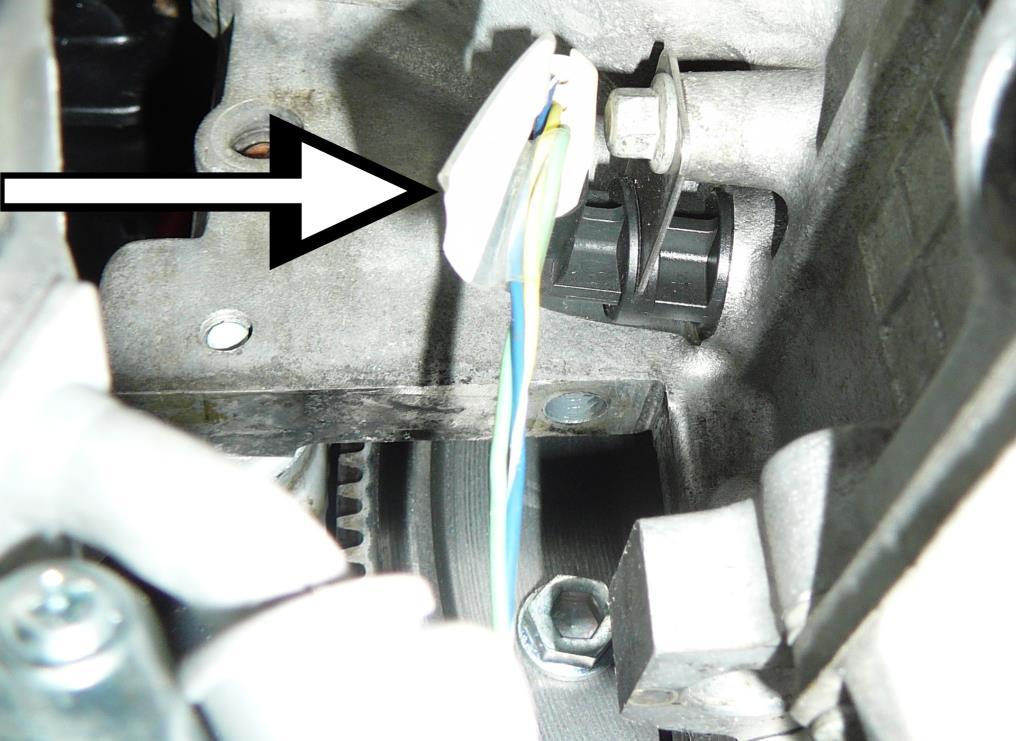 18. Plug the black three pin crankshaft position sensor connector (labeled CKP) into the crankshaft position sensor located on the passenger side of the engine just