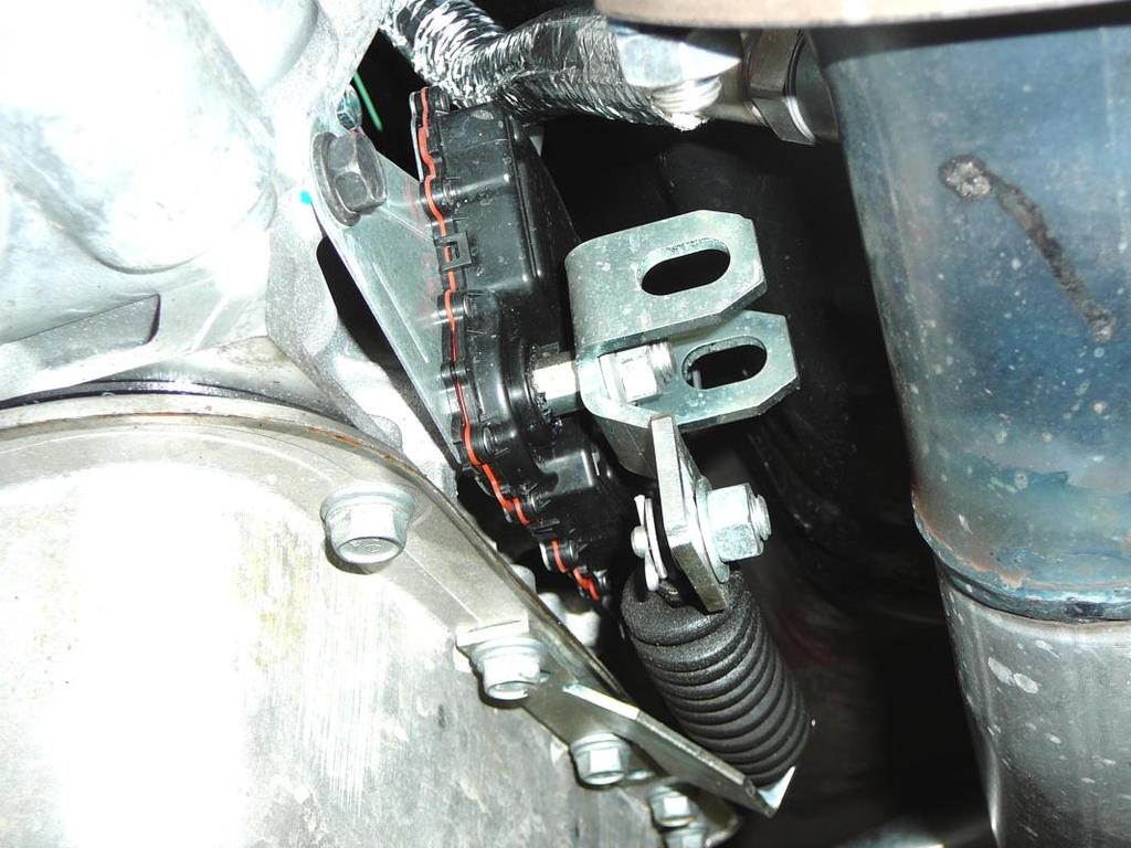 20. Plug the black four pin passenger side oxygen sensor connector (labeled PASS SIDE OXY) into
