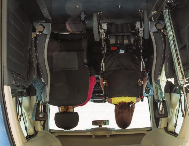 With the front passenger seat removed, a wheelchair or powerchair user can enter by the rear access ramp and move right up to the forward position.